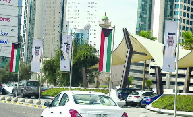 Kuwait celebrates with flags, portraits of leaders