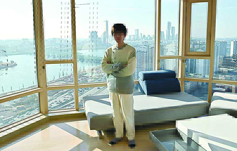 Joshua Ahn, CEO of South Korean production company Starfish Entertainment, posing during an interview with AFP at his home in Seoul.