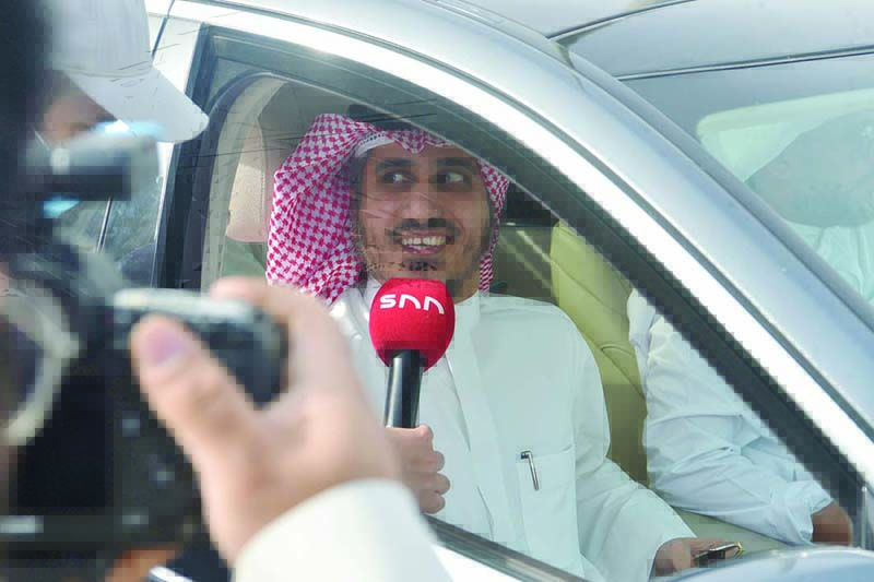 Bader Al-Dahoum speaks to the media outside the Assembly. <br>