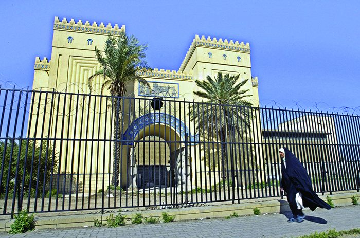 This file photo taken on March 13, 2004, shows an Iraqi woman walking past Iraq’s National Museum in the capital Baghdad, established by British archaeologist, writer, diplomat and spy Gertrude Bell.