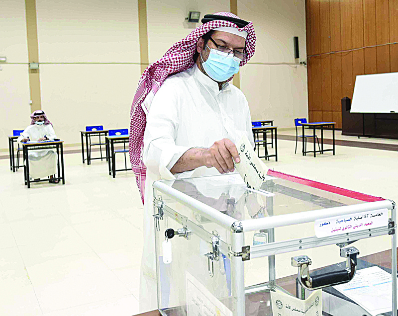 A man casts his vote at a polling station in Sabahiya.<br>