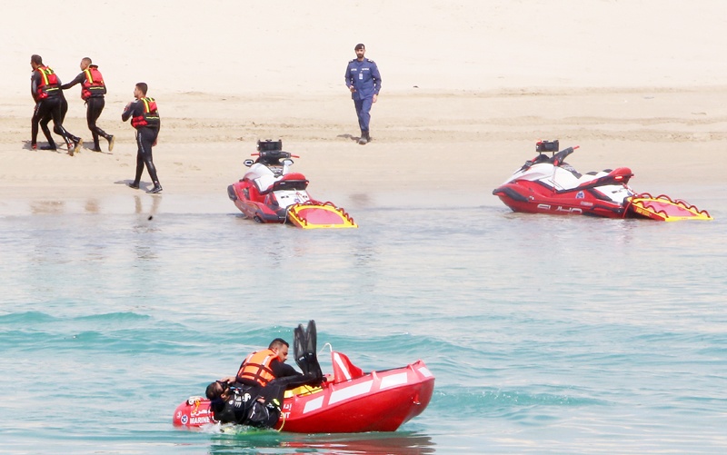 Rescue boats and jet skis are seen during the drill.<br>