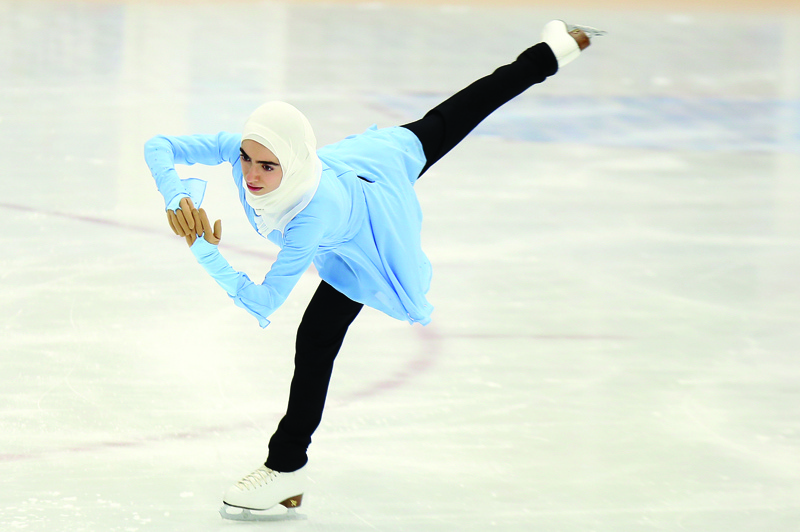 Girls participate in a figure skating tournament held at the Kuwait Winter Games Club's ice skating rink.