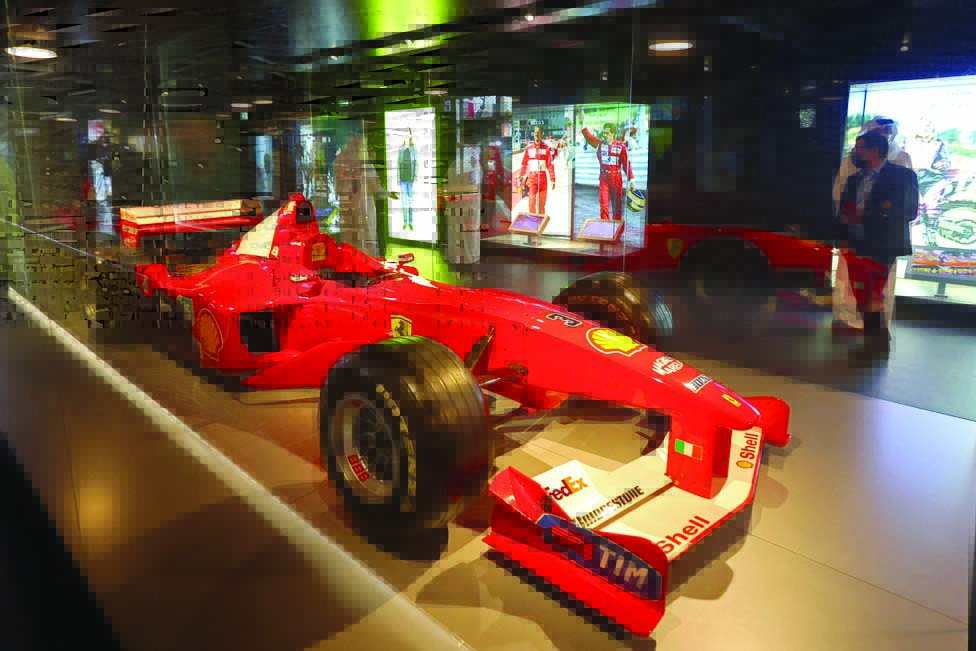 A Ferrari driven by Formula One champion Michael Schumacher is on display.