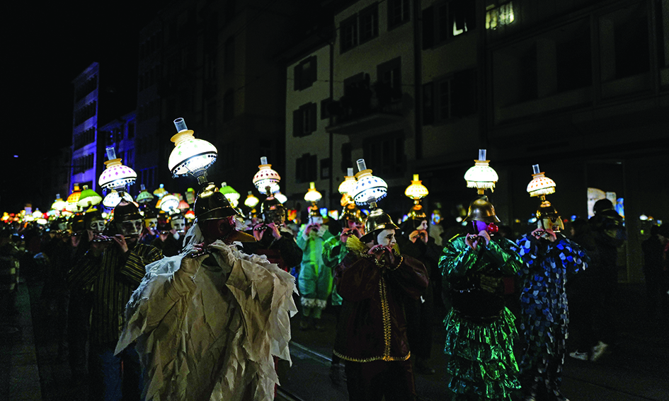 Lanterns light the way as  Basel carnival comes back