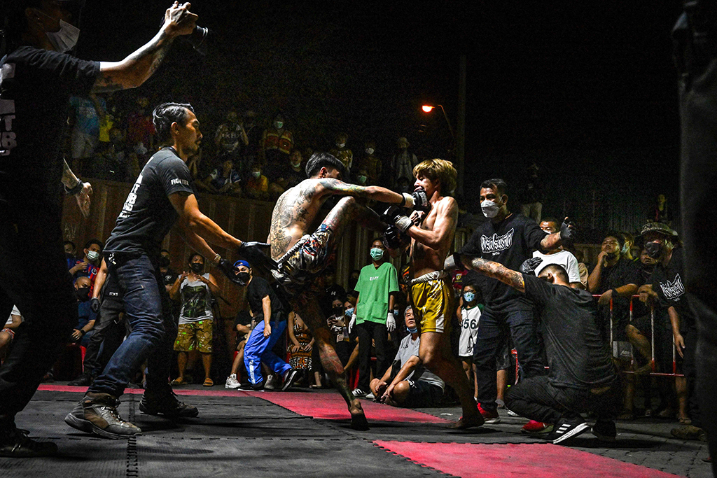 This photo shows combatants competing in Muay Thai at an event by Fight Club Thailand.