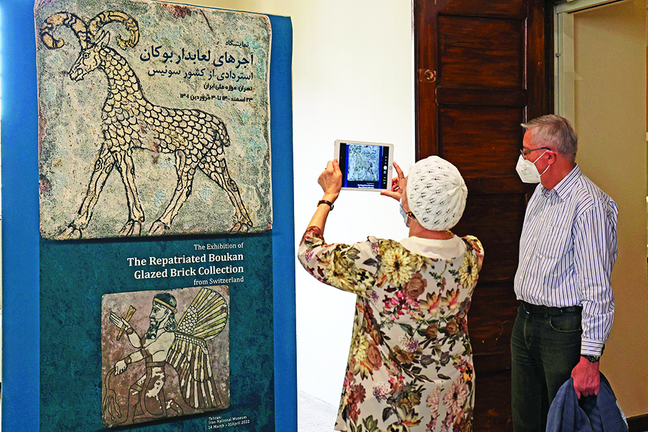 Visitors attend an exhibition entitled the Repatriated Boukan Glazed Brick Collection from Switzerland.