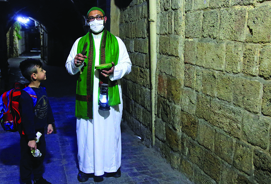 Mahmud Fannas, a man who carries out the traditional role of a