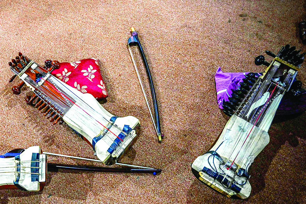 Traditional sarangi are placed on the carpet at a music academy in Lahore.