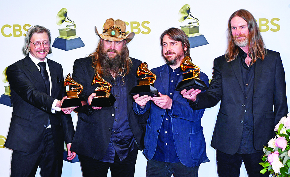 US singer-songwriter Chris Stapleton (second left) poses with the award the award for Best Country Album for 