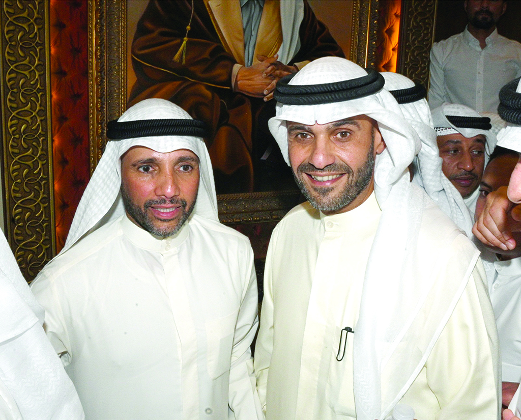 Marzouq Al-Ghanem with former minister Anas Al-Saleh.