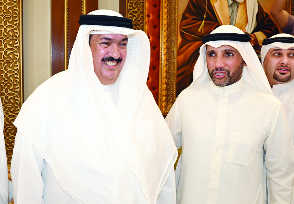 Marzouq Al-Ghanem with Minister of Education Ali Al-Mudhaf.