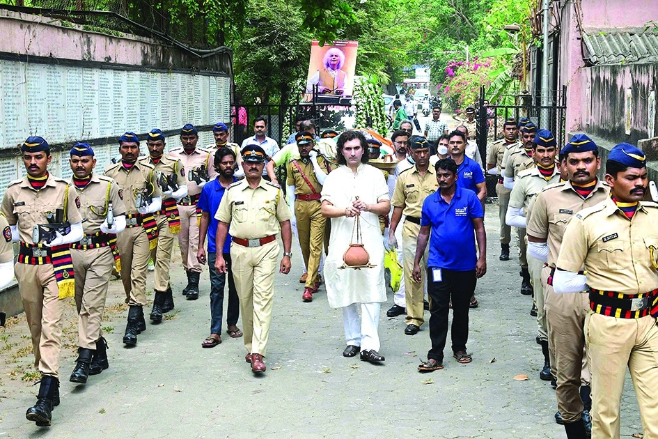 Policemen and family members take part in the funeral ceremony of legendary Indian composer and santoor player Shivkumar Sharma, in Mumbai on Wednesday.