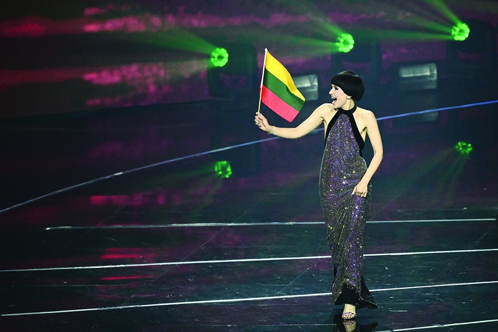 Singer Monika Liu, who is to perform on behalf of Lithuania, arrives onstage during the presentation of participating finalists.