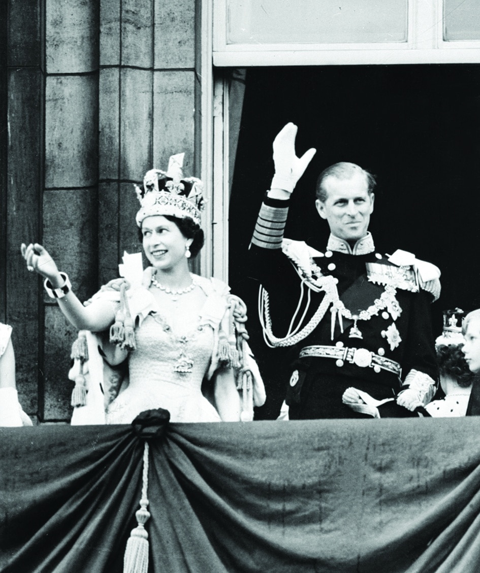 In this file photo taken on June 02, 1953 Britain's Queen Elizabeth II (left) and Britain's Prince Philip, Duke of Edinburgh wave to the crowd from the Balcony at Buckingham Palace, following her coronation. 