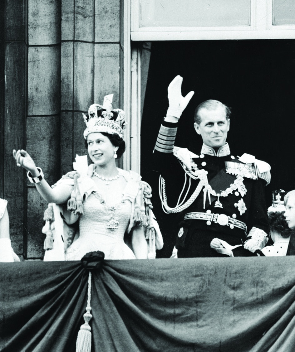 In this file photo taken on June 02, 1953 Britain's Queen Elizabeth II (left) and Britain's Prince Philip, Duke of Edinburgh wave to the crowd from the Balcony at Buckingham Palace, following her coronation.