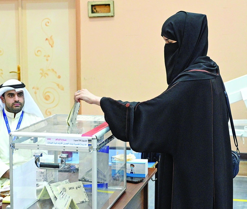A voter casts her vote in Sabah Al-Salem.