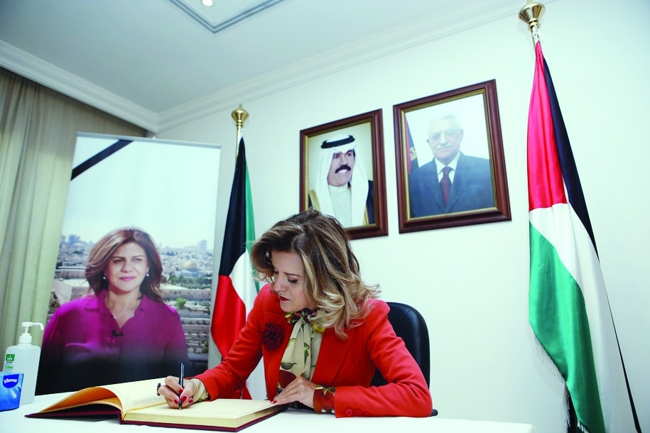 French Ambassador to Kuwait Claire Le Flecher writes in the condolences book.