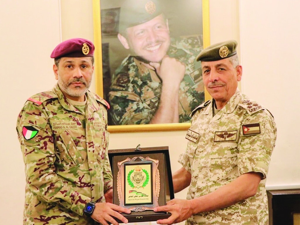 Officials exchange memorial shields at the end of the exercise.