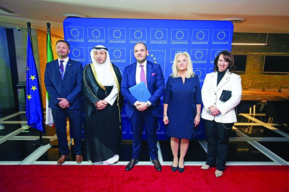 EU Ambassador to Kuwait Cristian Tudor (center), Kuwait’s Assistant Foreign Minister for Europe Affairs Nasser Al-Heen (center left) and other officials pose for a group photo.<br>