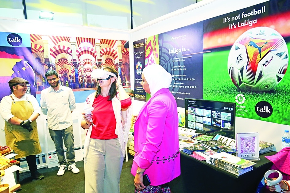A visitor uses virtual reality at Spain’s booth.<br>