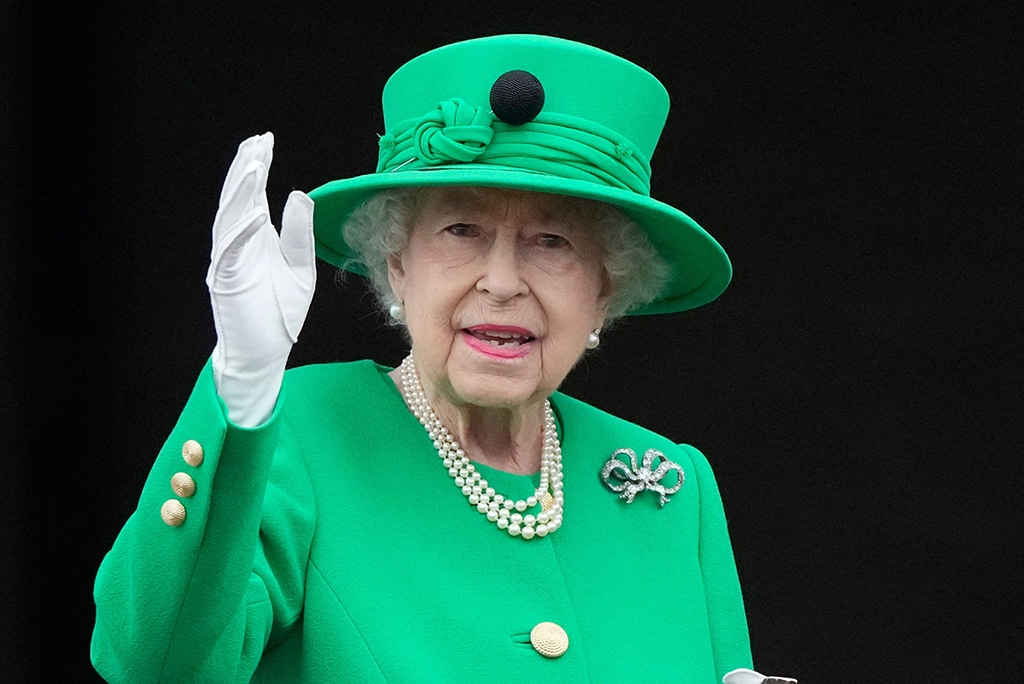 Britain's Queen Elizabeth II waves to the crowd from Buckingham Palace balcony at the end of the Platinum Pageant in London as part of Queen Elizabeth II's platinum jubilee celebrations. 