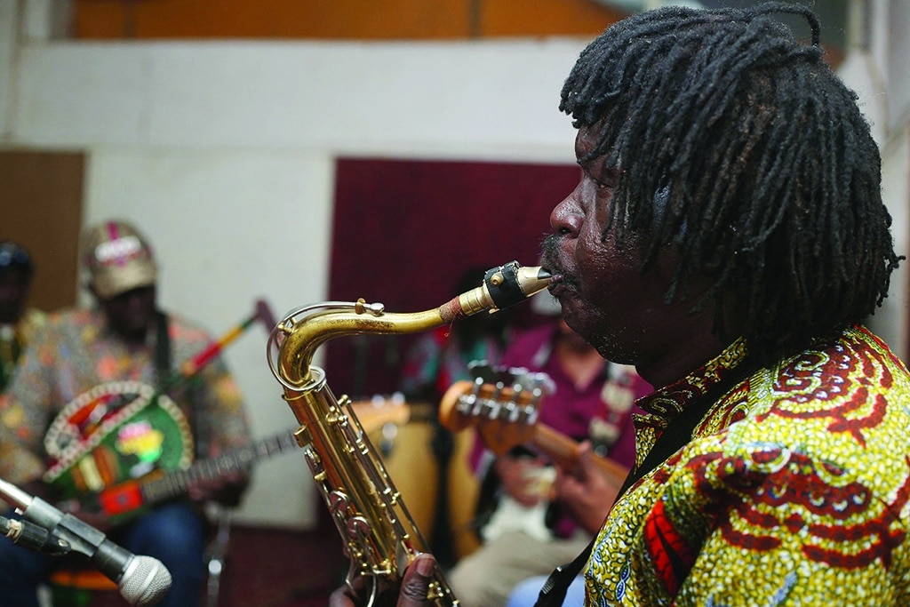 A saxophonist plays a song during rehearsals at a studio in Omdurman, the capital Khartoum's twin city.