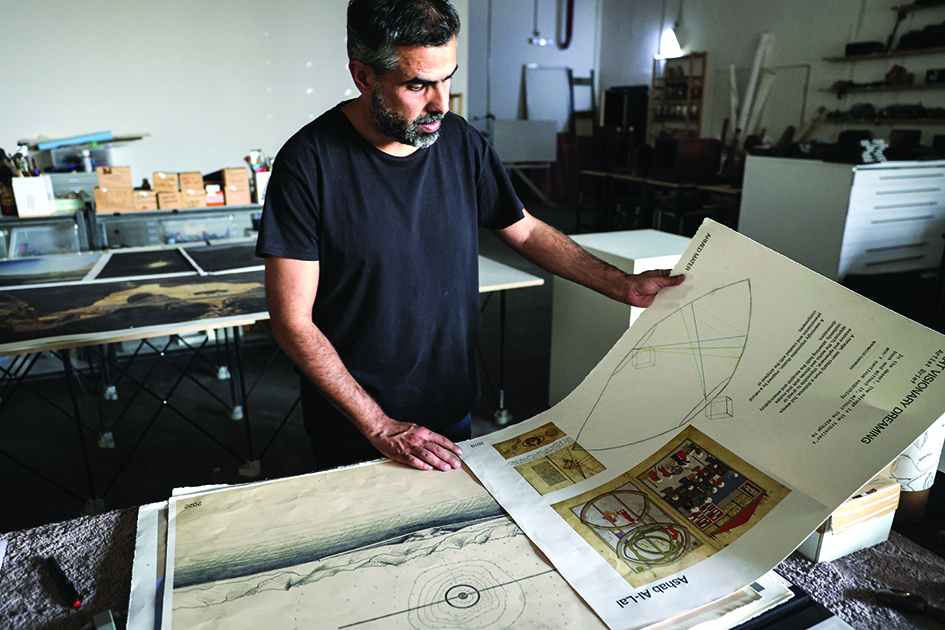 Saudi artist Ahmed Mater works at his studio in the capital Riyadh.