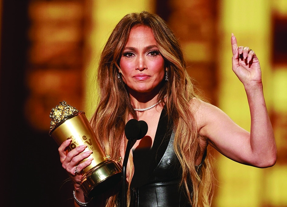 US actress-singer Jennifer Lopez receives the MTV Generation Award on stage.