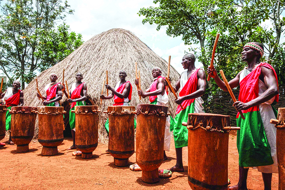 Elite drummers performers perform in front of the re-constructed house of the king’s village at Gishora Drum Sanctuary in Gishora, Burundi.