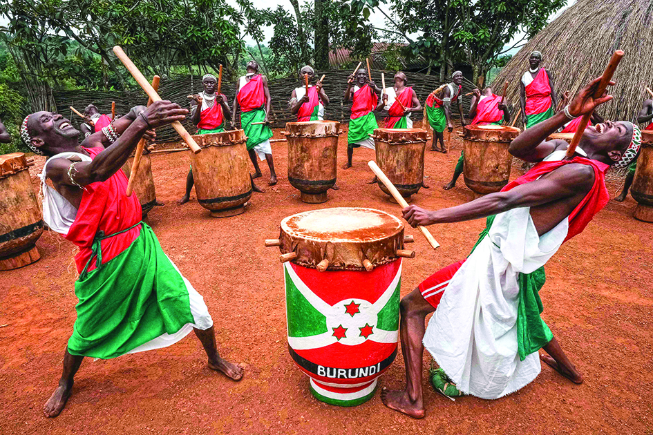 Elite drummers performers perform in front of the re-constructed house of the king’s village at Gishora Drum Sanctuary in Gishora, Burundi.