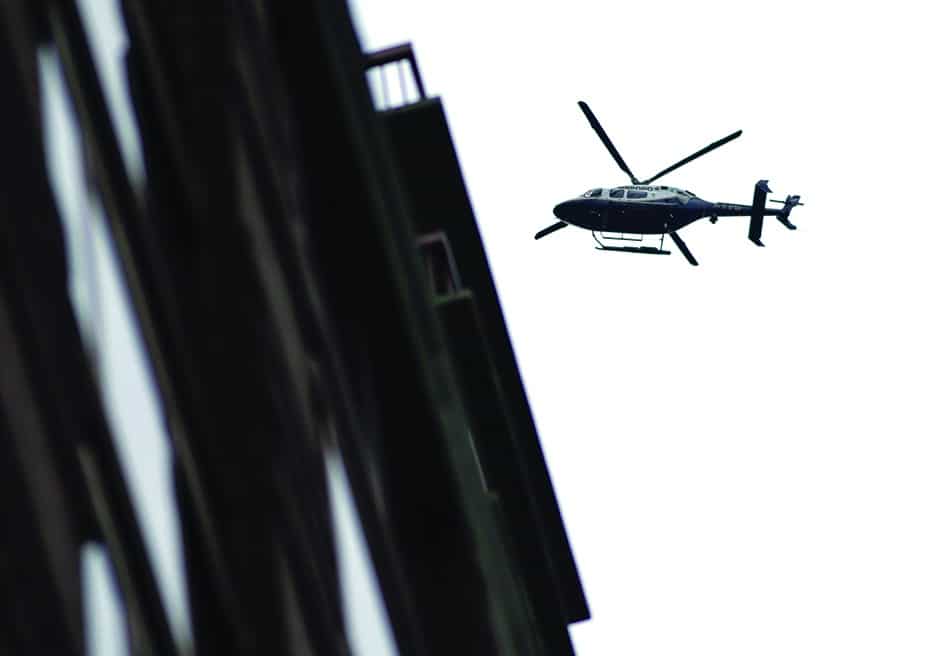 In this file photo a police helicopter flies over the scene where suspicious package was found in Midtown Manhattan in New York City. 