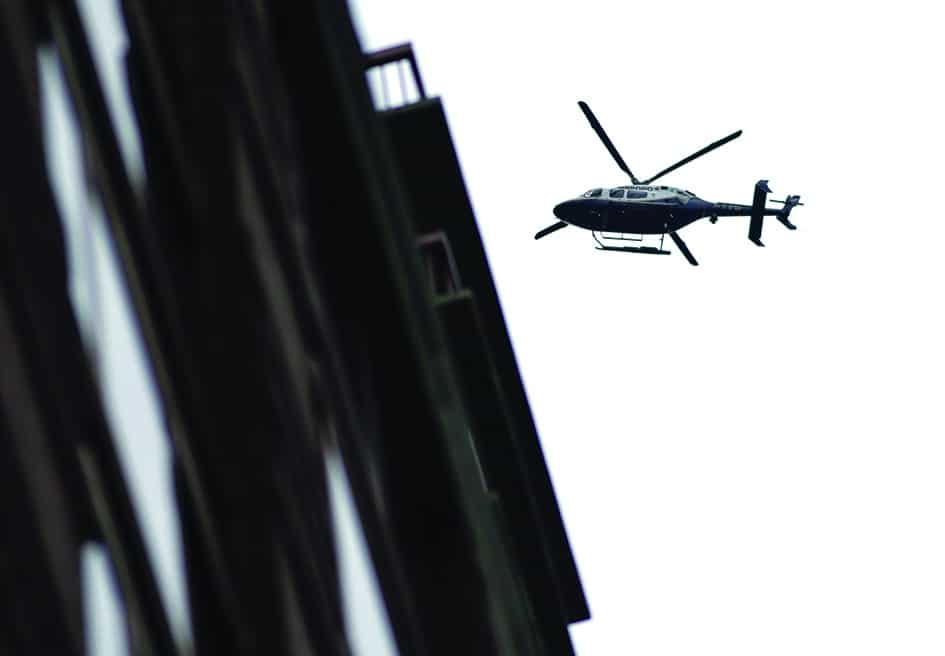 In this file photo a police helicopter flies over the scene where suspicious package was found in Midtown Manhattan in New York City.