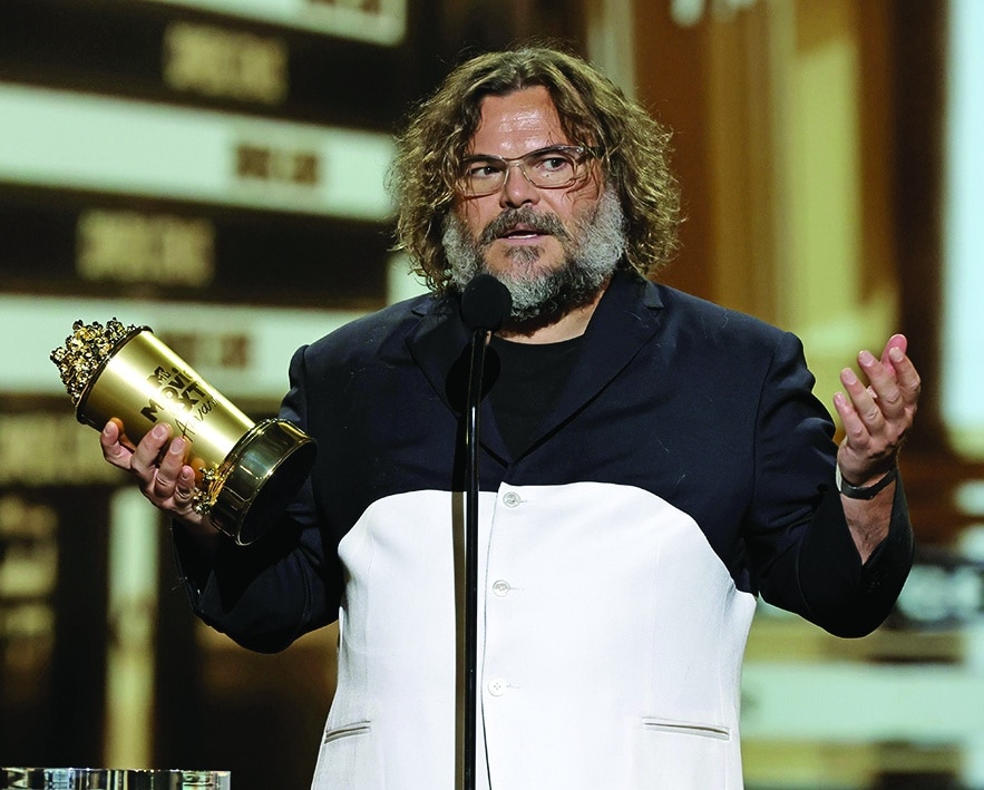 Jack Black accepts the Comedic Genius Award onstage. 