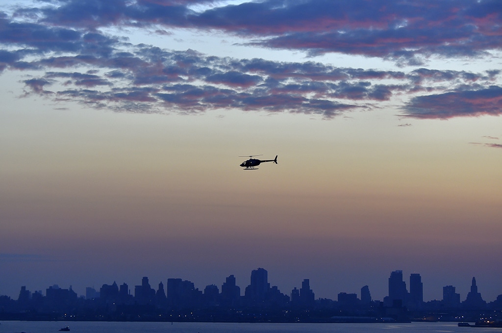 In this file photo a helicopter flies over Brooklyn, in New York City.