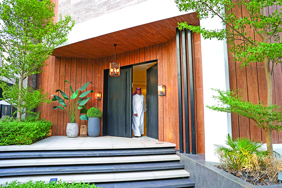 Haitham Al-Madini opens the door to his recently renovated villa in the Saudi capital, Riyadh.
