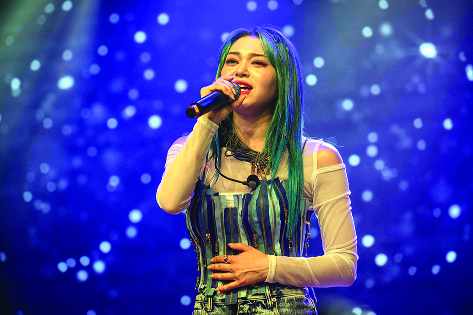 Korean-American K-pop star AleXa sings during a mini concert at a television studio in Seoul.