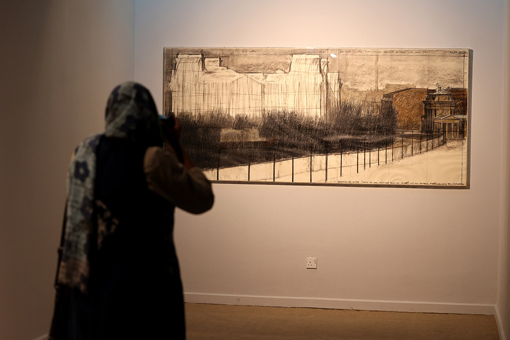 A visitor looks at an installation by Bulgarian-born artist Christo and his late wife Jeanne-Claude.