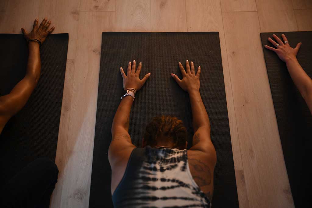 Yoga students attend a class at the studio