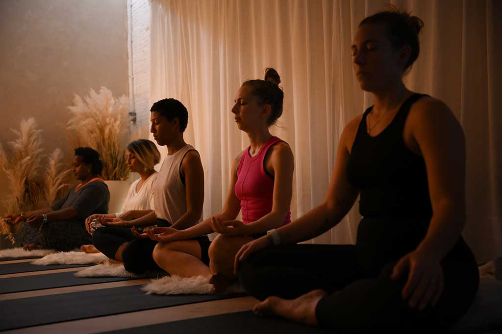 Yoga students attend a class at the studio