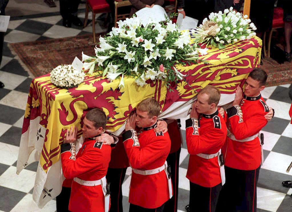 In this file photo taken on September 6, 1997, the coffin of Diana, Princess of Wales, is carried inside Westminster Abbey for her funeral service following her tragic death in a Paris car crash last weekend.