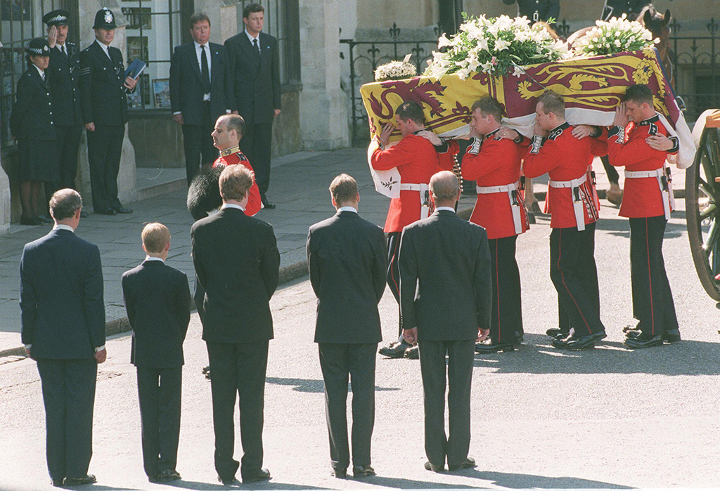 In this file photo taken on September 6, 1997 Prince Charles, Prince Harry, Earl Spencer, brother of the Princess of Wales the Duke of Edinburgh and Prince William, watch as the coffin of the Princess of Wales is carried into Westminster Abbey.