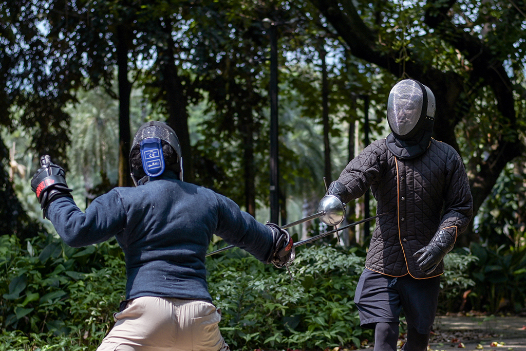 This picture shows members of the Gwaith-i-Megyr group practicing sword-fighting techniques known as Historical European Martial Arts (HEMA) at a park in Jakarta.