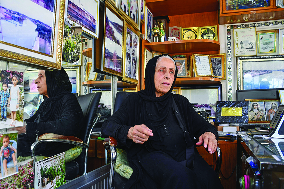 Iraqi photographer Samira Mazaal speaks during an interview at her studio.
