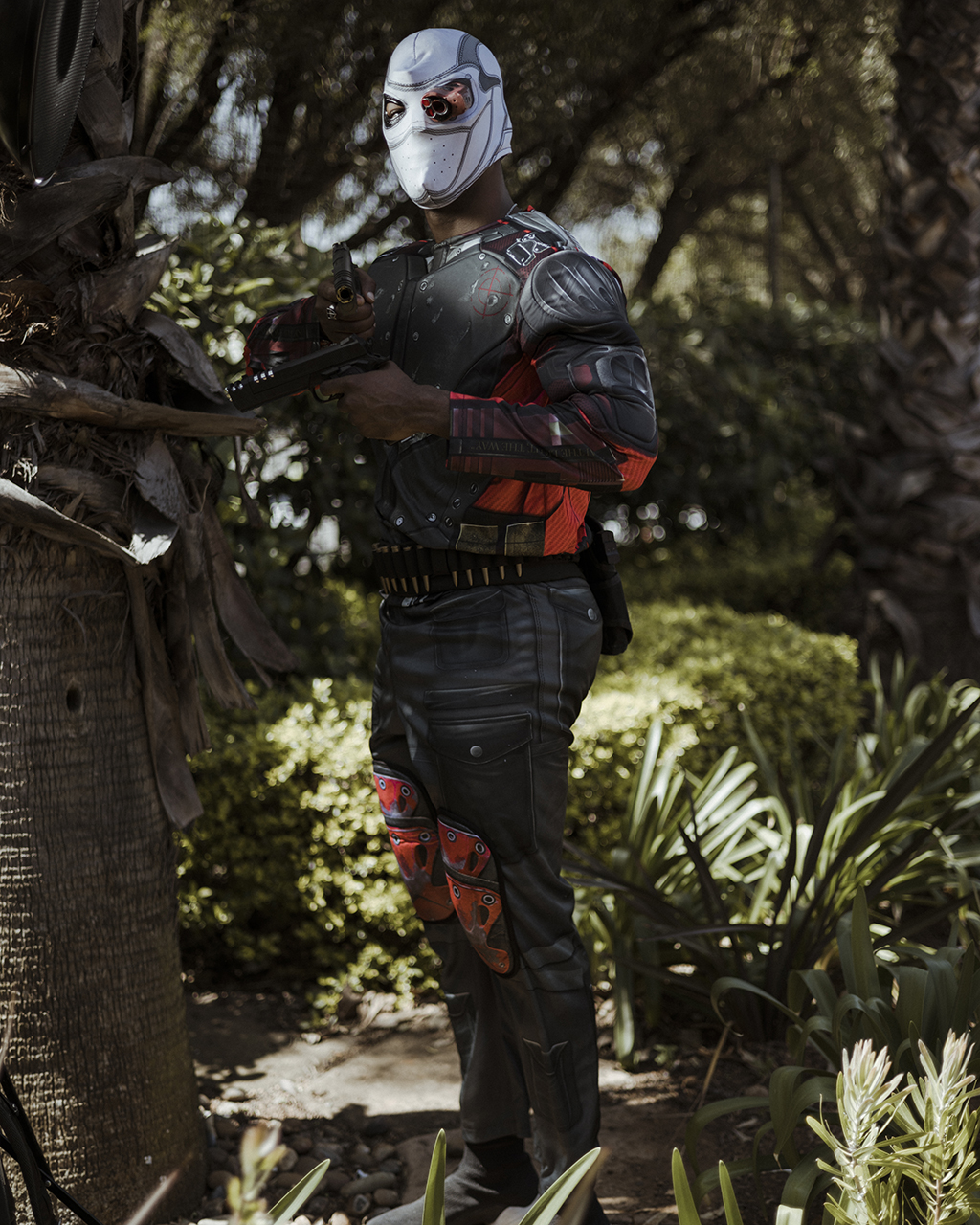 South African cosplayer Deddy Watezwa, 23, poses for a portrait while dressed as the supervillain Deadshot.