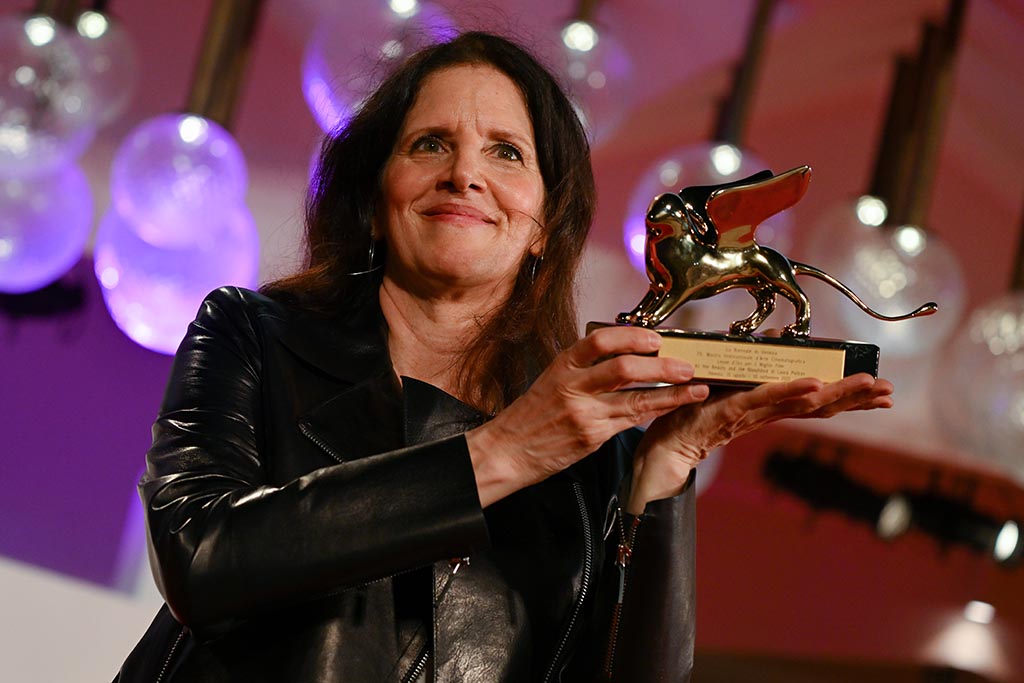 US director Laura Poitras poses with the Golden Lion for Best Film she received for 