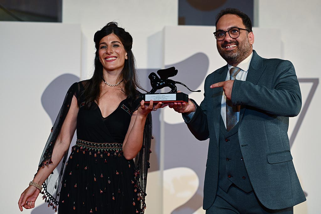 French Iranian actress Mina Kavani and Iranian actor Reza Heydari pose with the Special Jury Prize they received, on behalf of jailed Iranian director Jafar Panahi, for 