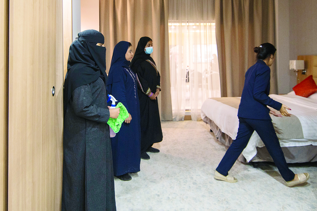 Students take part in a practical training course, as part of a Saudi state-run 