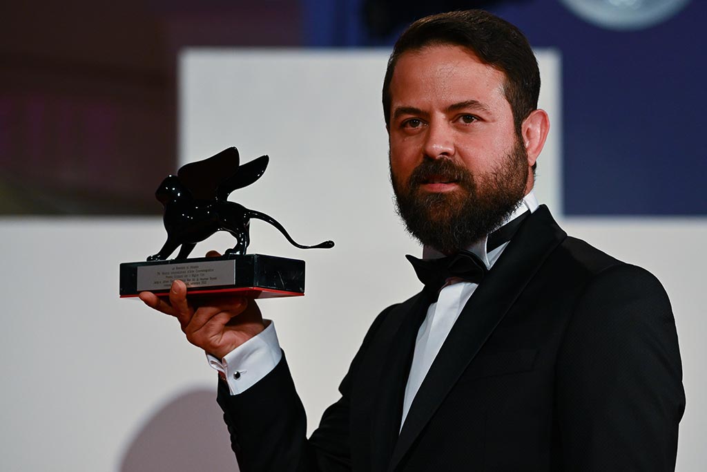 Iranian director Houman Seyyedi poses with the Orizzonti Award for Best Film he received for