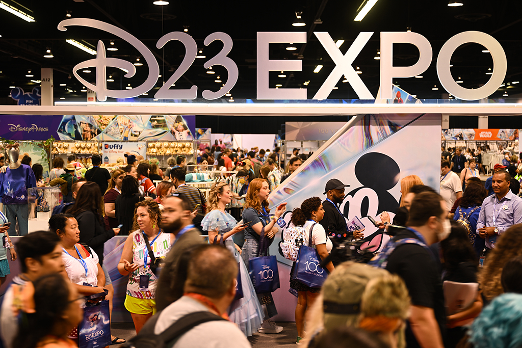 Fans wait in line to visit the D23 Expo Marketplace to buy merchandise during the Walt Disney D23 Expo.